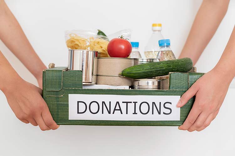 volunteers-holding-box-filled-with-food-donation